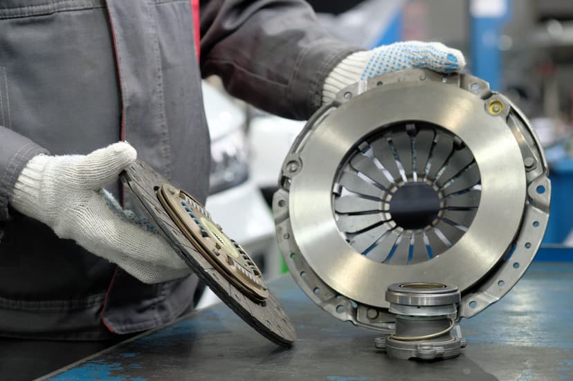 Technician inspecting an industrial clutch assembly